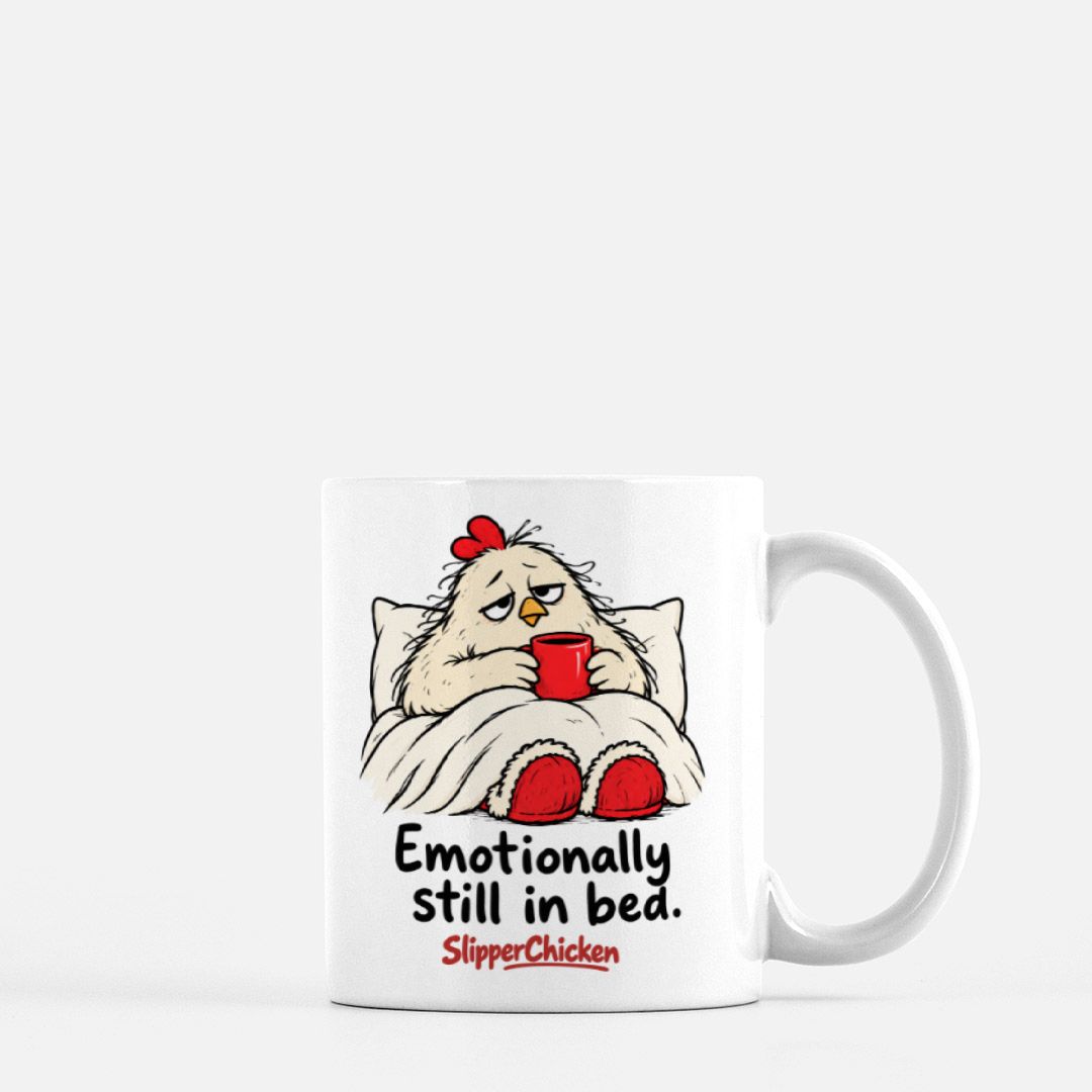 White Sleepy Mug with a chicken tucked into bed, Emotionally still in bed quote, and red SlipperChicken logo