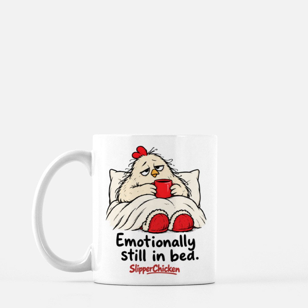 White Sleepy Mug with a chicken tucked into bed, Emotionally still in bed quote, and red SlipperChicken logo