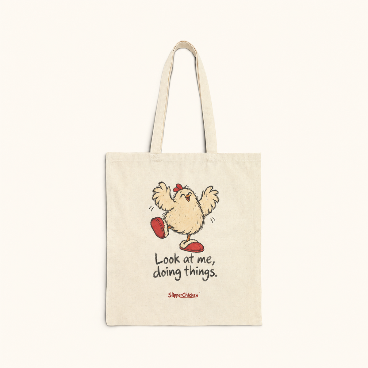 Natural canvas Delighted Tote with joyful wings-up chicken, Look at me, doing things. in two lines and a small red SlipperChicken signature, on a warm tan background; supplier print proportions retained.
