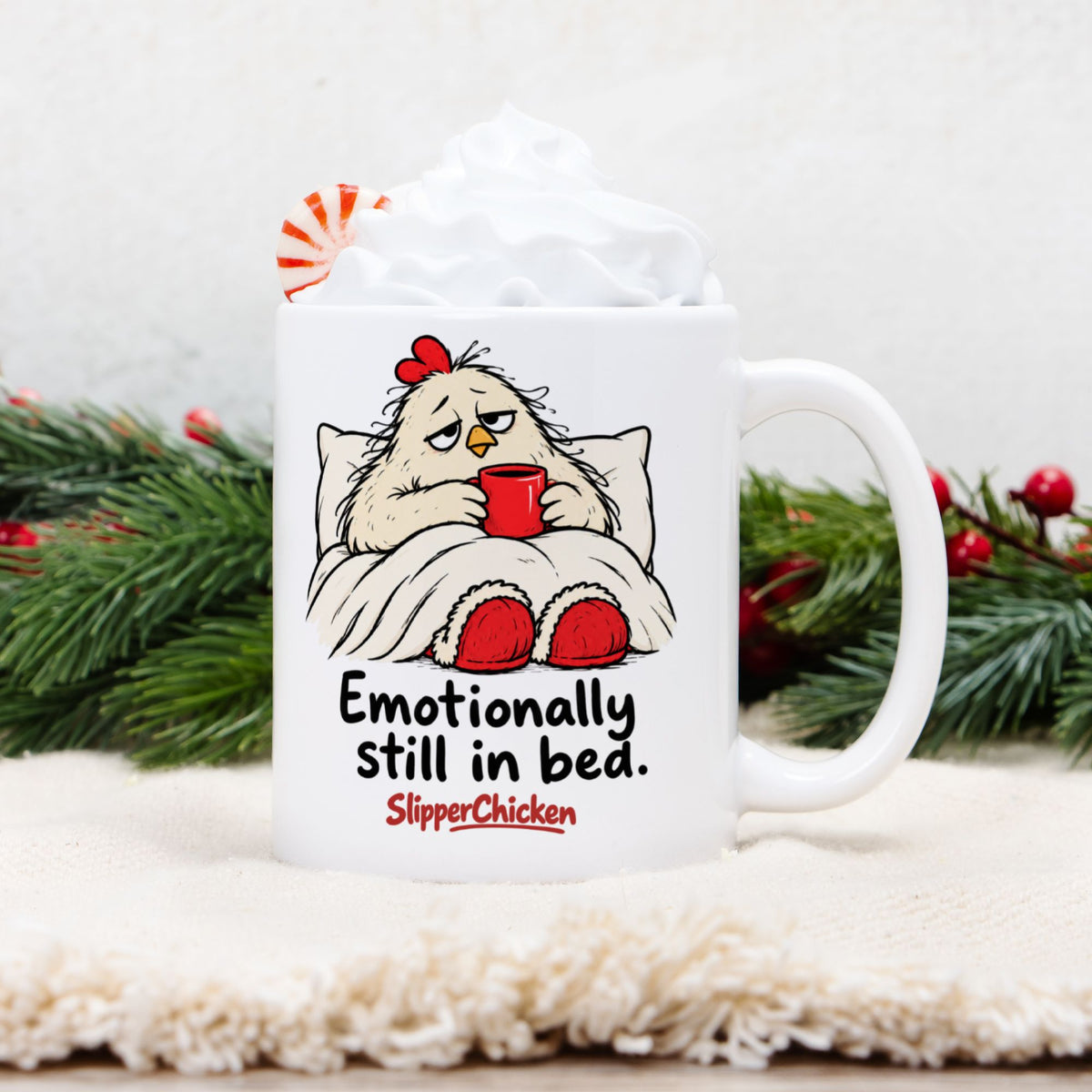 White Sleepy Mug with a chicken tucked into bed, Emotionally still in bed quote, and red SlipperChicken logo
