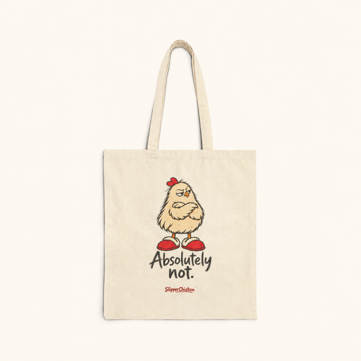 Natural canvas Unimpressed Tote with crossed-wing chicken, Absolutely not. in two lines and discreet red SlipperChicken signature, on site tan at actual supplier print proportions.