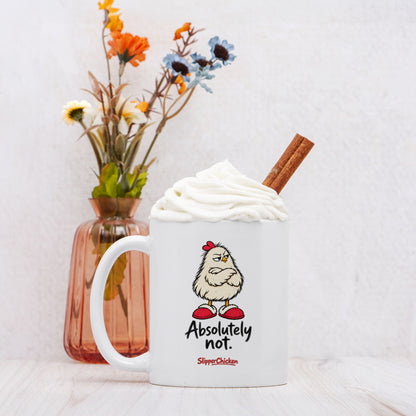 Unimpressed Mug topped with whipped cream and a cinnamon stick beside a vase of flowers