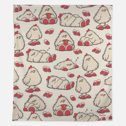 Cream Sleepy Blanket with five scattered SlipperChicken poses, red slippers, tiny sleep marks and one small red SlipperChicken™ logo in the lower-right corner