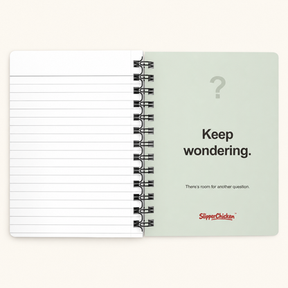Curious Journal light-green Keep wondering. inside-back cover beside white lined pages, on site tan.